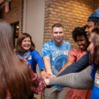 people with hands in